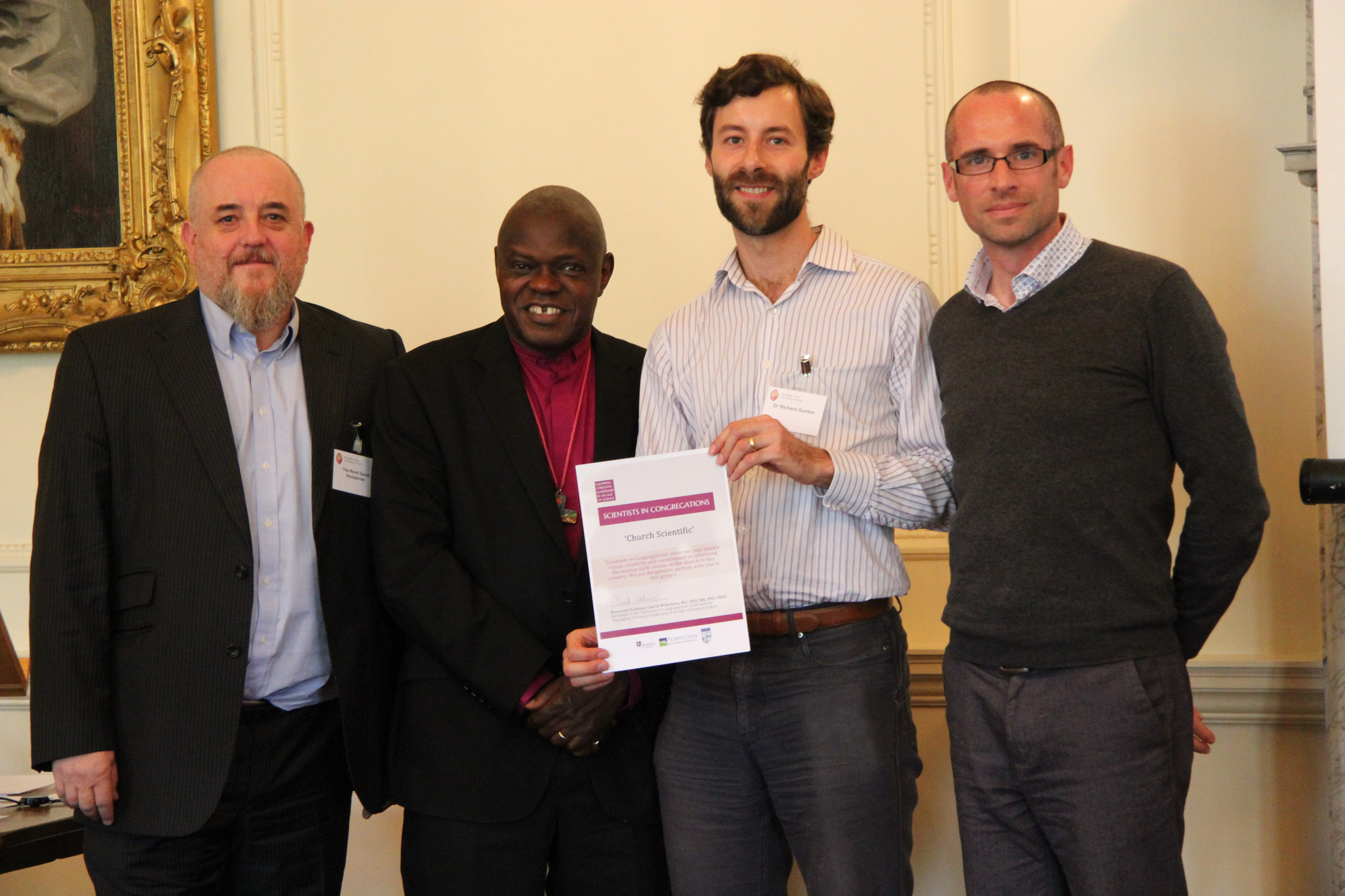 Church Scientific team receiving certificate from Archbishop John